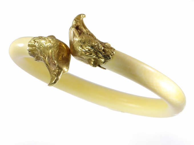 French Late Victorian antique ivory bangle with big gold eagle head ornaments by Unknown artist