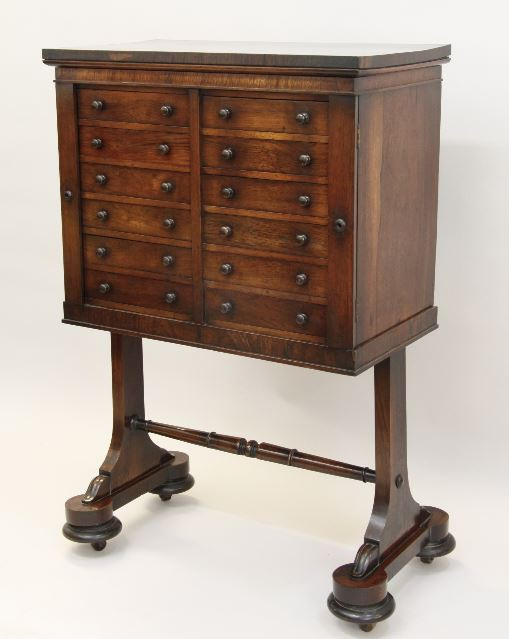 A Regency rosewood collectors cabinet on separate base. by Unknown artist