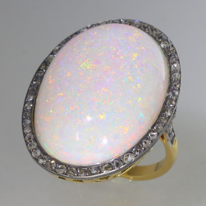 Vintage gold ring with humongous 30+ carat high quality opal and 56 rose cut diamonds by Unknown Artist