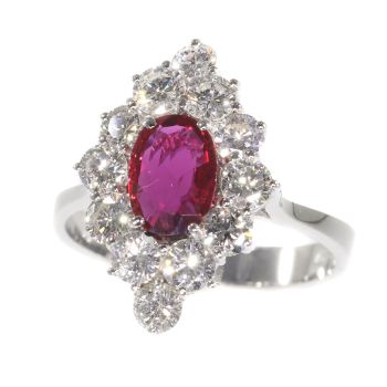 Vintage 1970's ring with beautiful ruby and set with 12 brilliant cut diamonds by Unknown Artist