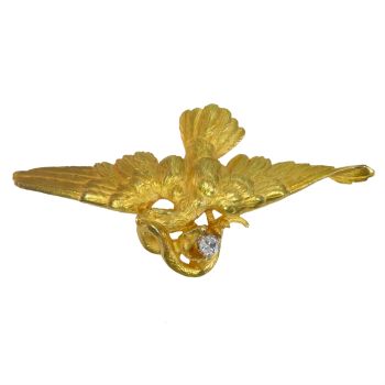 Vintage French antique brooch/pendant flying eagle fighting a snake holding a diamond in its beak by Artiste Inconnu