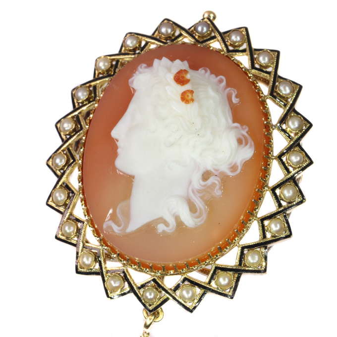Victorian hard stone cameo in gold mounting with half seed pearls black enamel by Unknown artist