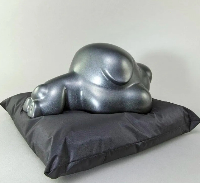 Baby (bronze and black pillow) by Poren Huang