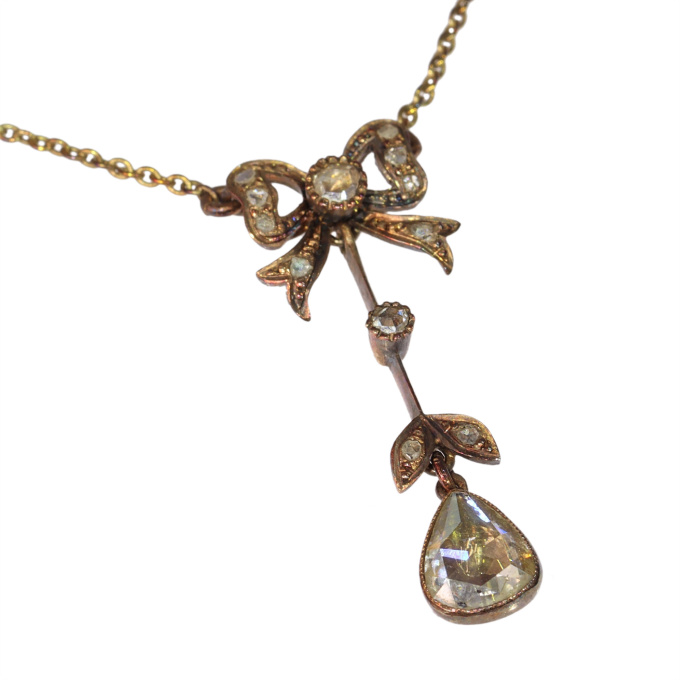Era of Elegance: 1890s Victorian Bow and Pear Diamond Pendant by Artiste Inconnu