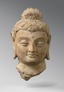 Head of a Bouddha by Onbekende Kunstenaar