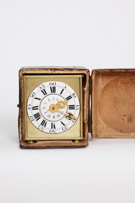 A rare and small German brass travel alarm clock with travel case, circa 1770 by Unknown artist