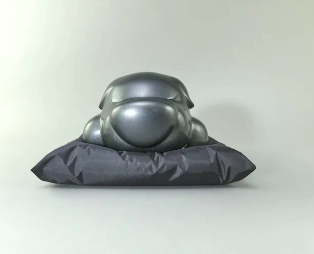 Baby (bronze and black pillow) by Poren Huang