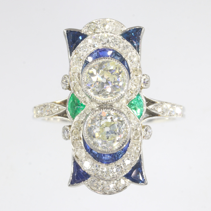 Vintage Art Deco strong design platinum ring with brilliant cut diamonds sapphires and emeralds by Unknown Artist