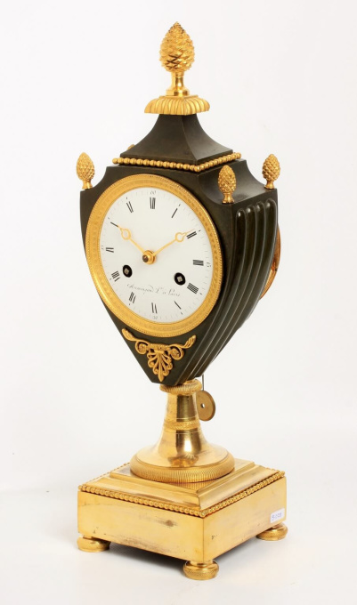 A fine French Empire ormolu and bronze urn mantel clock, circa 1800 by Armingaud Láîné à Paris