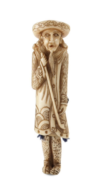 A BONE NETSUKE OF A DUTCHMAN HOLDING A PIPE AND HAVING DETACHABLE LEGS by Unknown artist