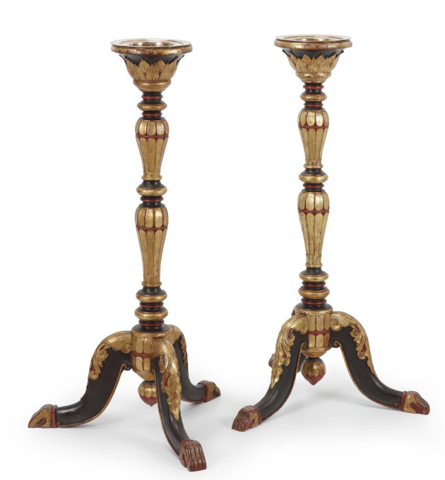 A PAIR OF INDONESIAN LACQUERED AND GILT TEAK TORCHÈRES OR CANDLE STANDS by Unknown Artist