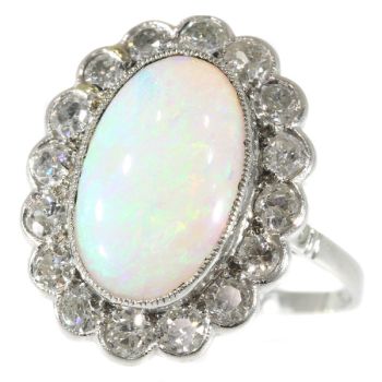 Vintage diamond opal engagement ring by Artista Desconocido
