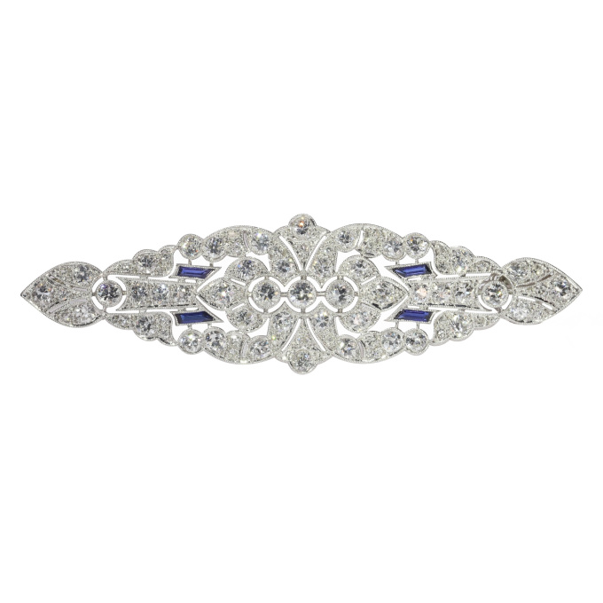 Vintage platinum Art Deco diamond brooch with sapphire accents by Artista Sconosciuto