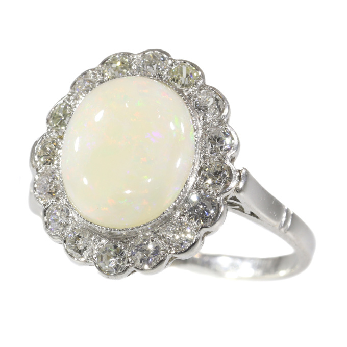 Vintage diamond and opal platinum engagement ring by Artista Desconhecido