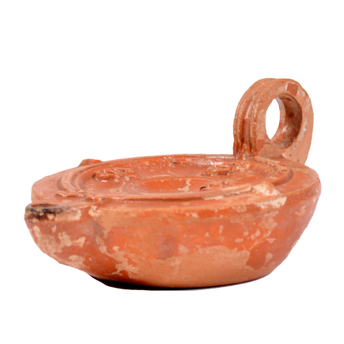  A Roman terracotta red slip ware oil lamp with theatre masks by Unknown artist