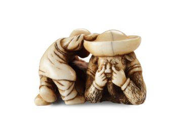 AN IVORY NETSUKE OF A DUTCHMAN FROLICKING WITH A SMALL BOY by Unknown Artist