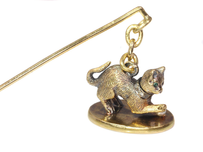 Antique gold kitten with diamond collar playing with little pearl on seal by Artista Desconocido