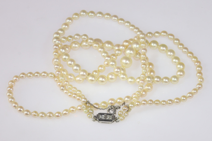 French vintage double strand pearl necklace with diamond closure by Artista Sconosciuto