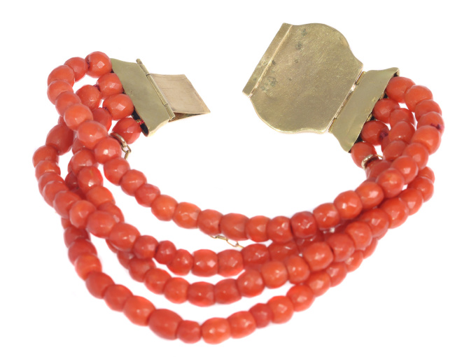 Antique four string coral bracelet with coral cameo in 18K gold closure by Artiste Inconnu