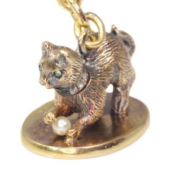 Antique gold kitten with diamond collar playing with little pearl on seal by Unknown Artist