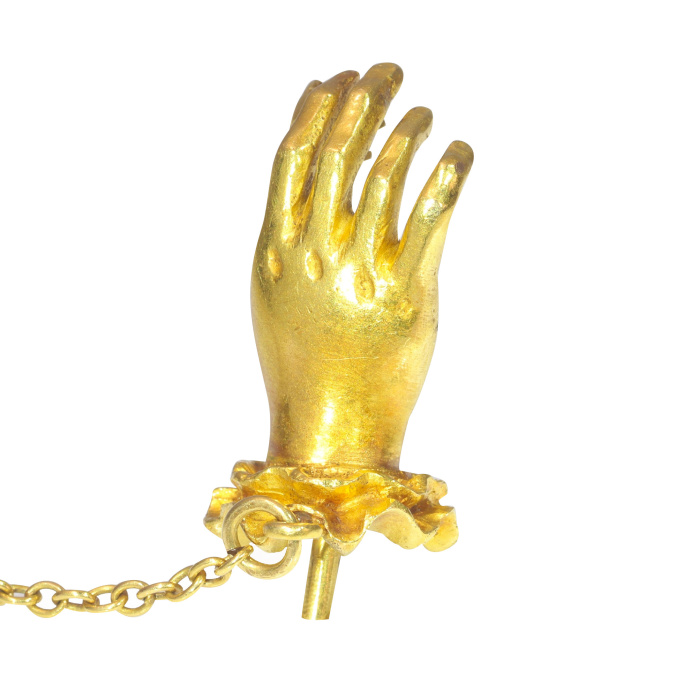 Antique 18K yellow gold tiepin hand holding an old mine cut diamond by Artista Desconocido