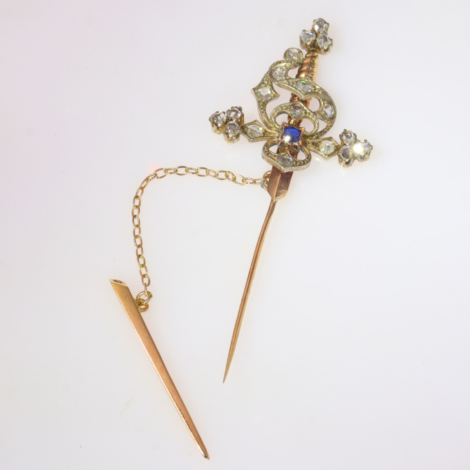 Vintage pin in the form of a sword set with diamonds and a sapphire by Unknown Artist