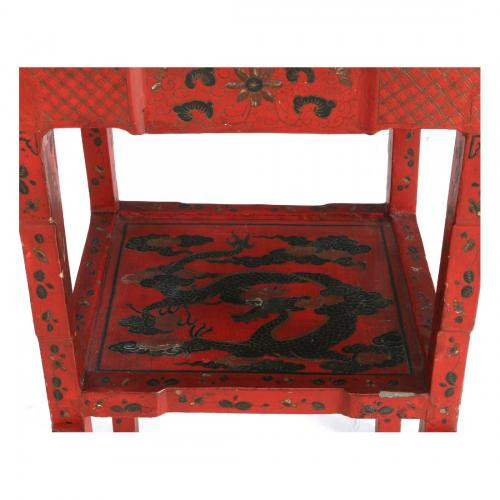 A pair of red-lacquered Chinese stands by Onbekende Kunstenaar
