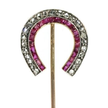 Antique tie pin lucky horse shoe with rose cut diamonds and rubies by Artista Desconocido