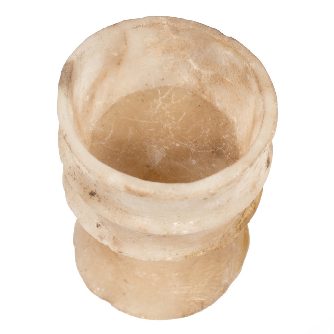  An Egyptian alabaster ribbed cup, New Kingdom, 18th dynasty by Unknown Artist